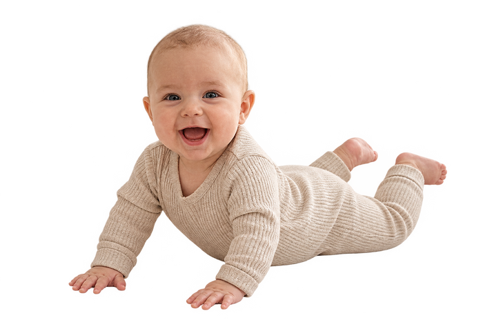 Happy baby doing tummy time on the Kest Nest lounger